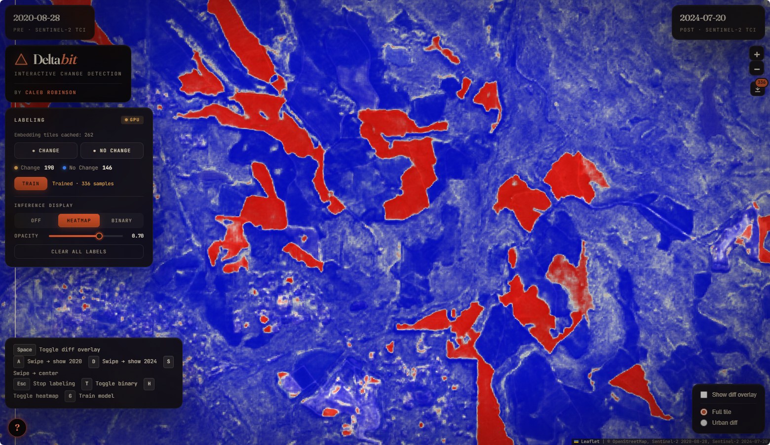 DeltaBit predicted change overlay. Cleared parcels are flagged red over a blue basemap.